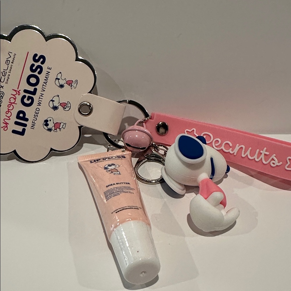 NWT Peanuts x Celavi Snoopy Lip Gloss w/ Vit E and Key Chain with Bag Charm.